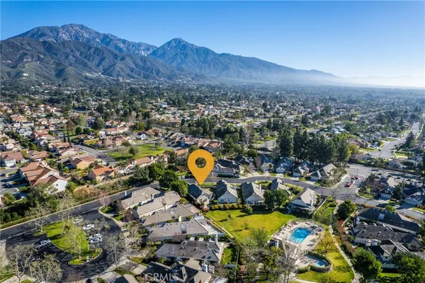 an aerial view of residential houses and outdoor space