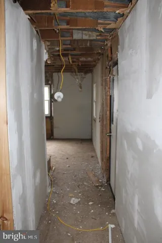 a view of a room with a glass door