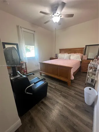 a bedroom with bed and window