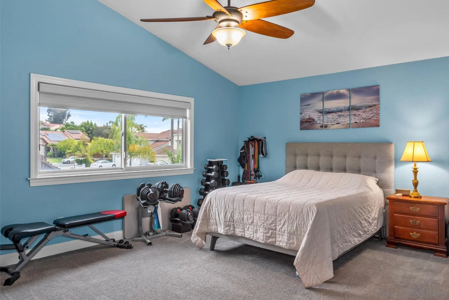 9342 Parus Point San Diego, CA 92129 - Photo 17 of 44 a bedroom with a bed and a chandelier