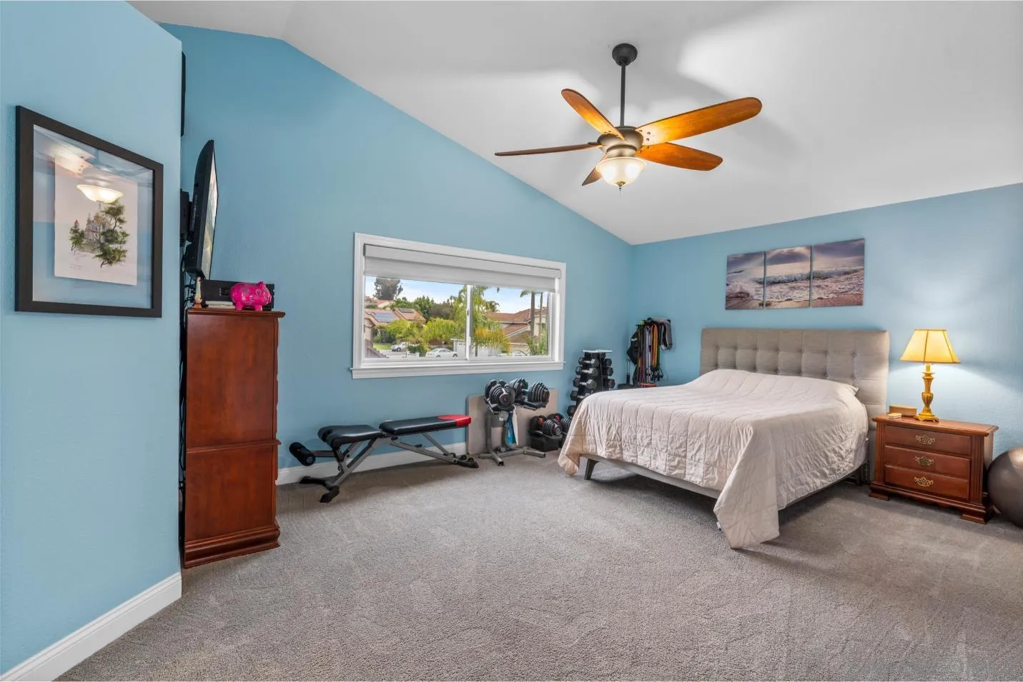 9342 Parus Point San Diego, CA 92129 - Photo 18 of 44 a bedroom with a bed and a chandelier