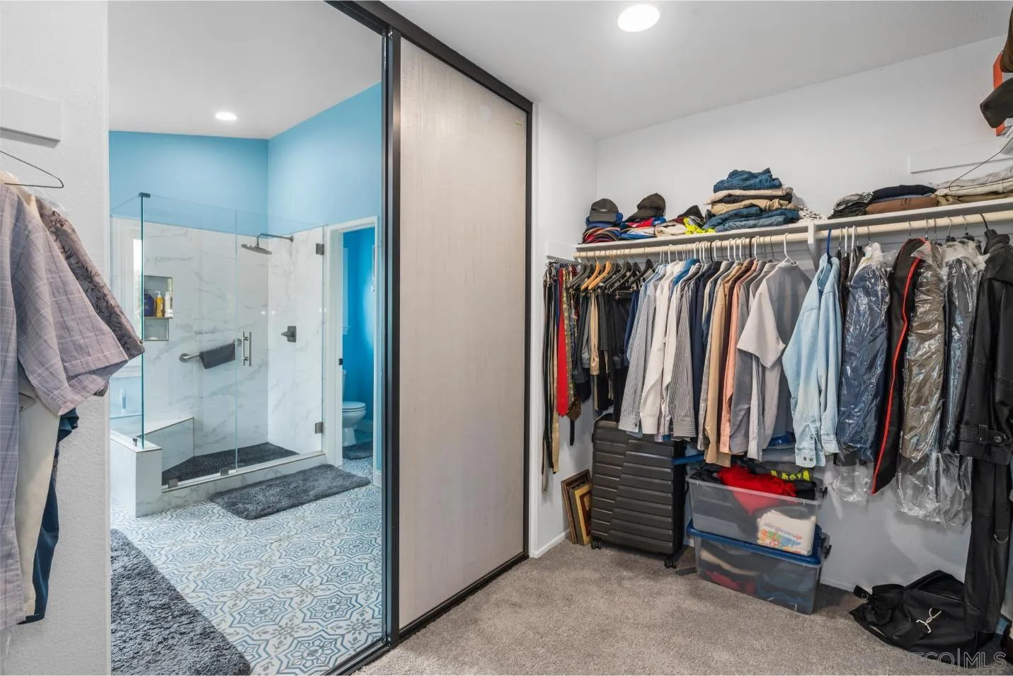 9342 Parus Point San Diego, CA 92129 - Photo 22 of 44 a view of walk in closet and bathroom