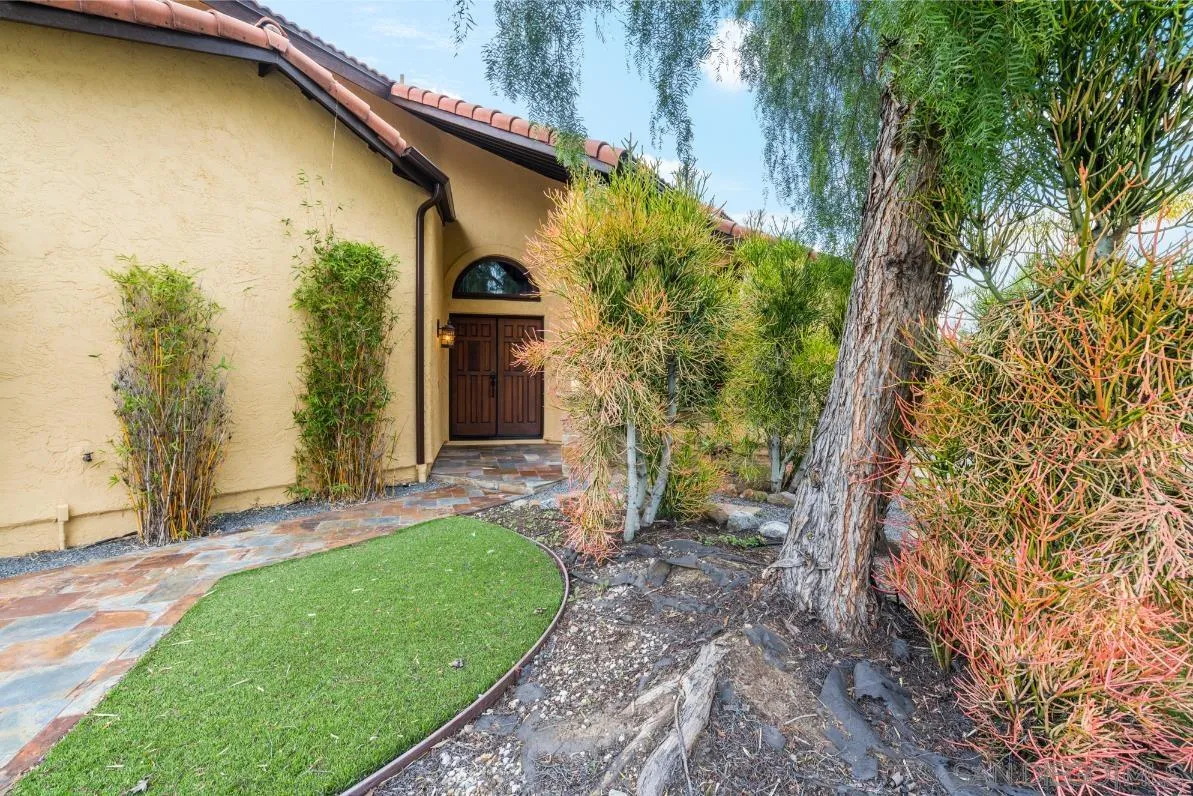 9342 Parus Point San Diego, CA 92129 - Photo 33 of 44 a front view of a house with a yard