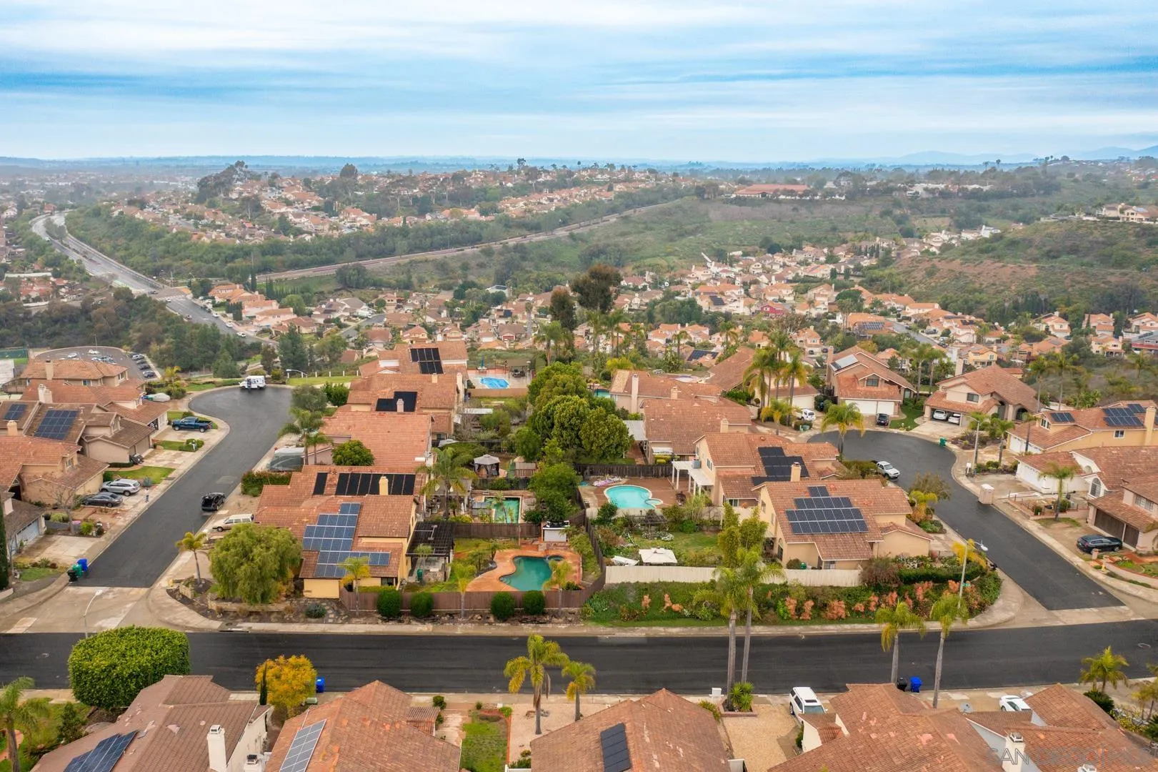9342 Parus Point San Diego, CA 92129 - Photo 39 of 44 an aerial view of a city with lots of residential buildings ocean and mountain view in back