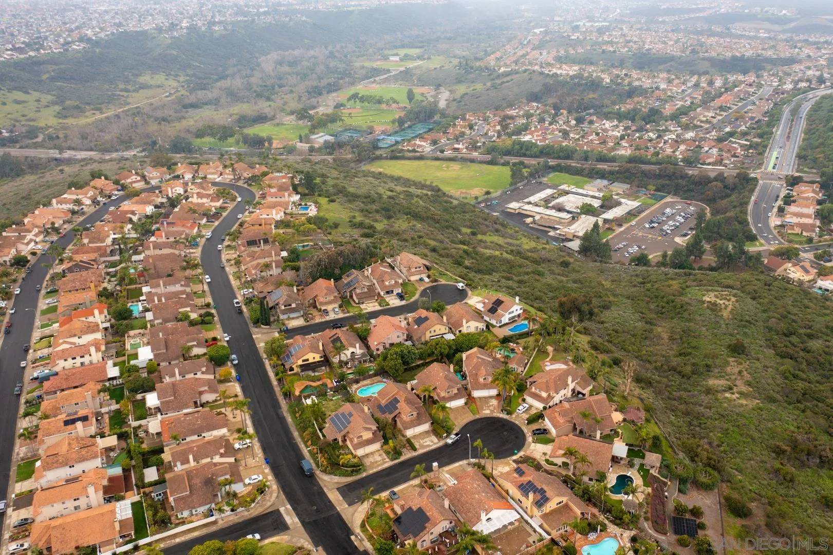 9342 Parus Point San Diego, CA 92129 - Photo 42 of 44 an aerial view of residential houses with outdoor space