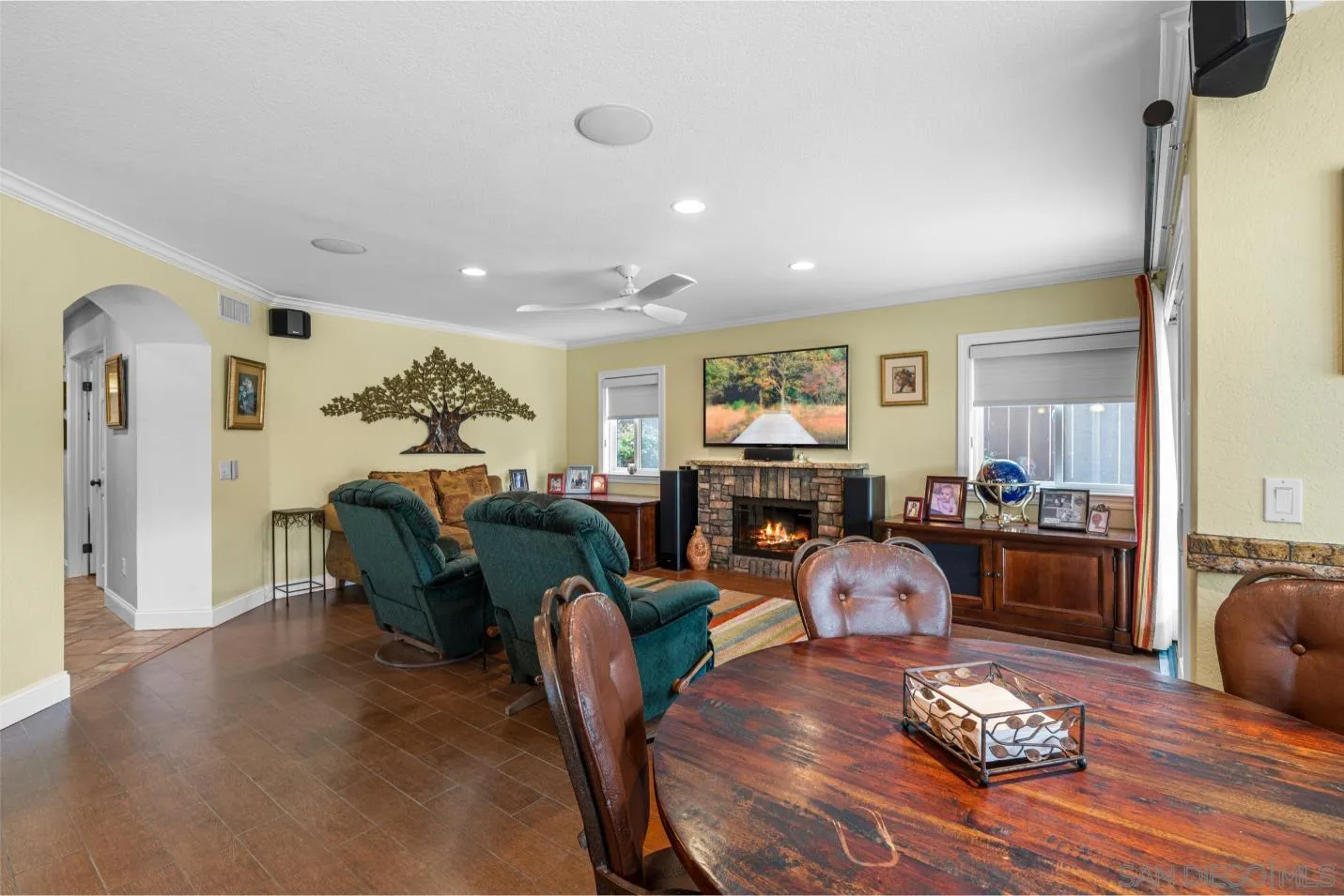 9342 Parus Point San Diego, CA 92129 - Photo 10 of 44 a living room with fireplace furniture and a wooden floor