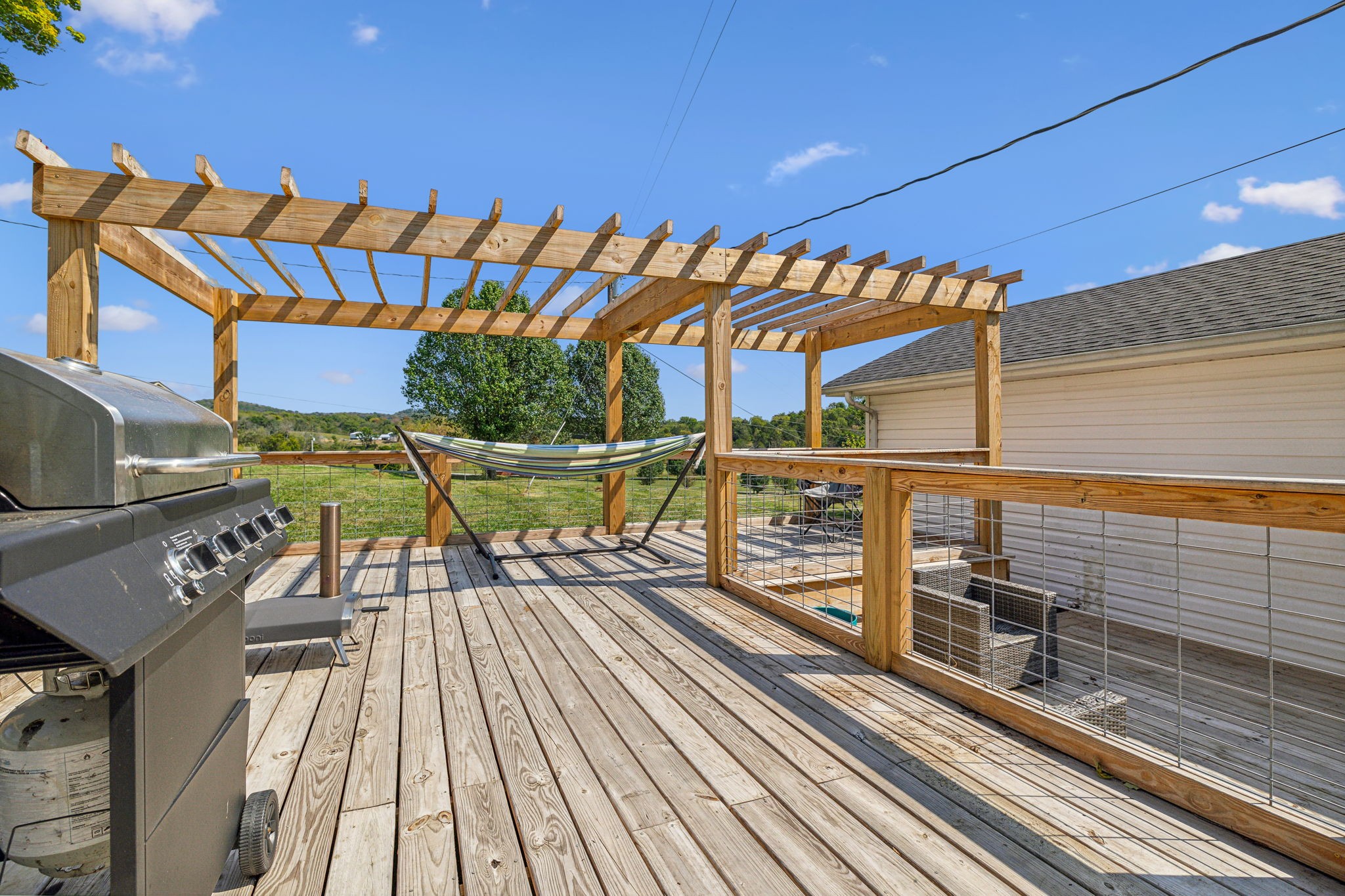 677 Puckett Road Watertown, TN 37184 - Photo 39 of 63 a view of a balcony with wooden floor and outdoor seating