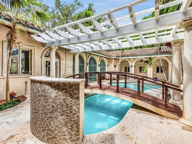 front view of a building with a garden