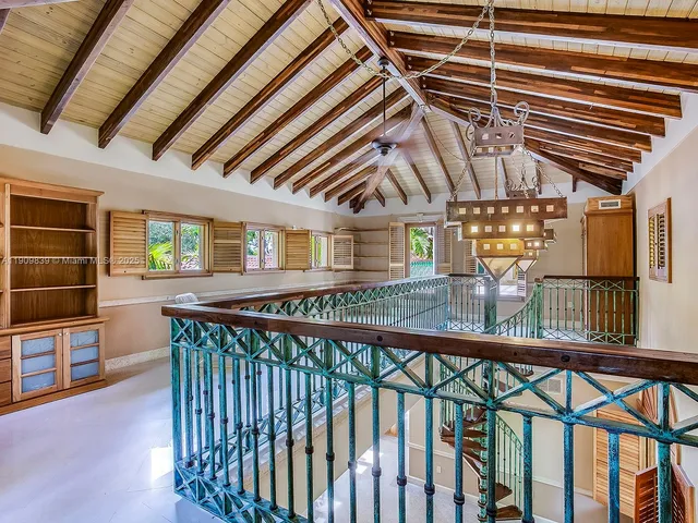 a bathroom with a granite countertop tub sink and mirror