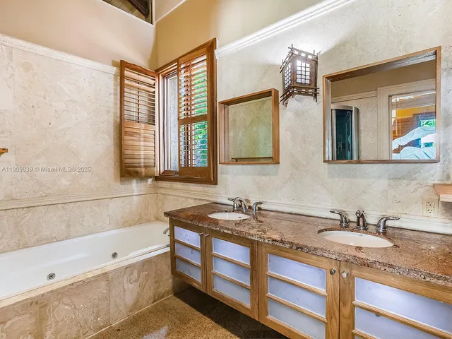 a bathroom with a toilet and a bathtub