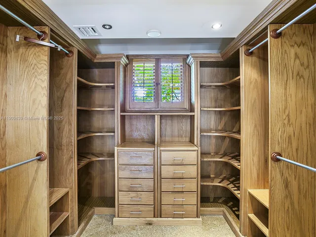 a view of a house with a porch and next to a yard