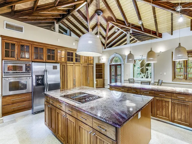 a kitchen that has a stove and a sink