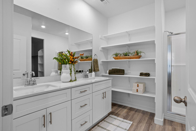 1624 South Staircase Way, Unit 4183 Washington, UT 84780 - Photo 10 of 47 Contemporary bathroom featuring dual white vanities with integrated sinks and a large frameless mirror