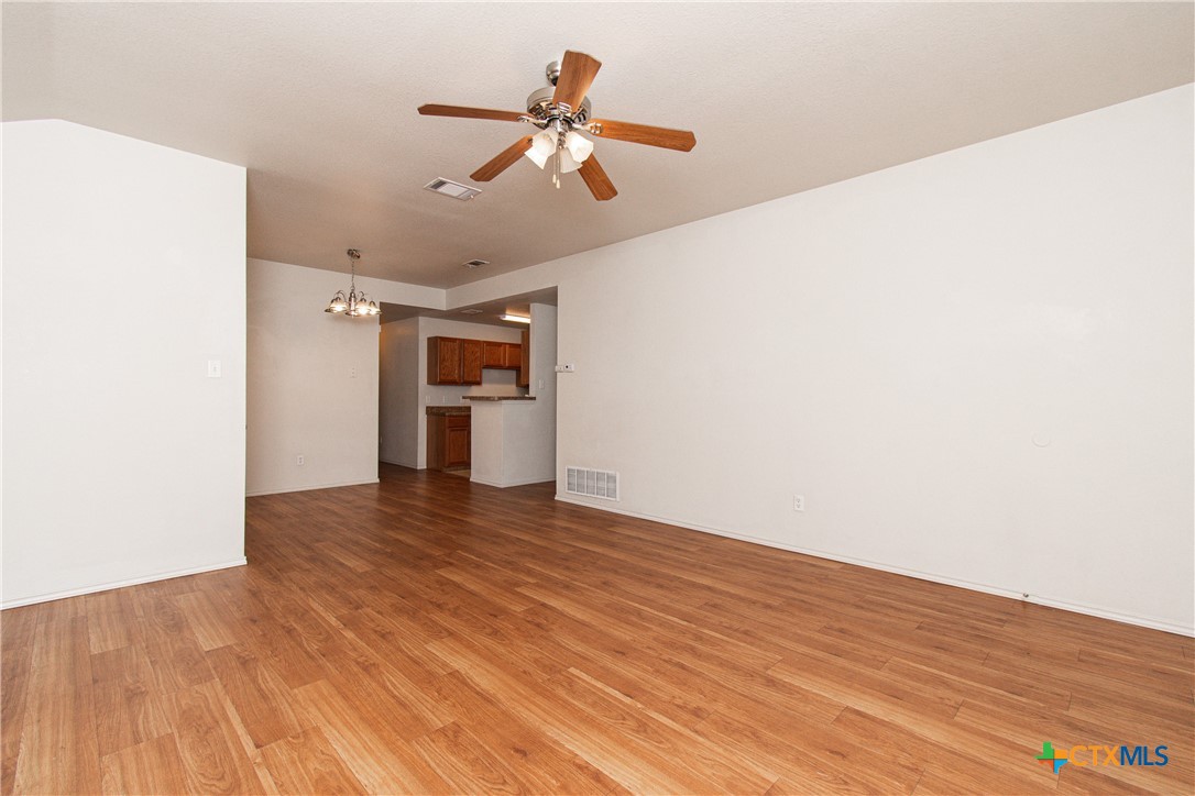 6509 Temora Loop, Unit A Killeen, TX 76549 - Photo 3 of 19 a view of empty room with wooden floor and ceiling fan