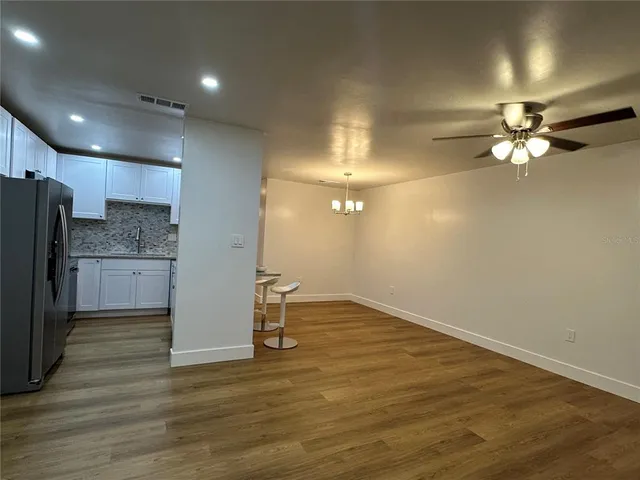 a view of a livingroom with a kitchen