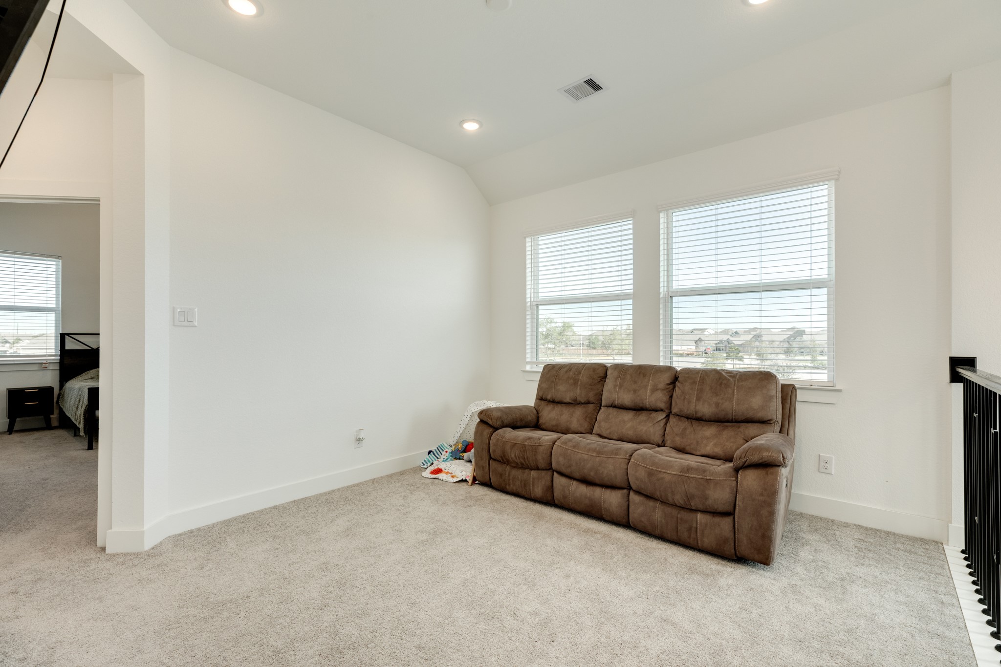 10002 Nectar Path Rosharon, TX 77583 - Photo 15 of 46 Alternate view of the spacious flex room, with views to the front door from the upper level. The entrance to the primary bedroom is located to the left.