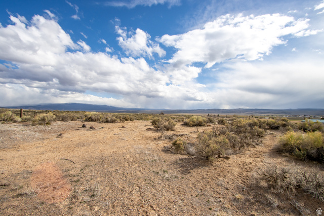 View of mountain backdrop with rural landscape
