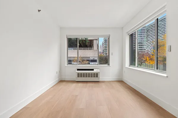 a view of an empty room with a window