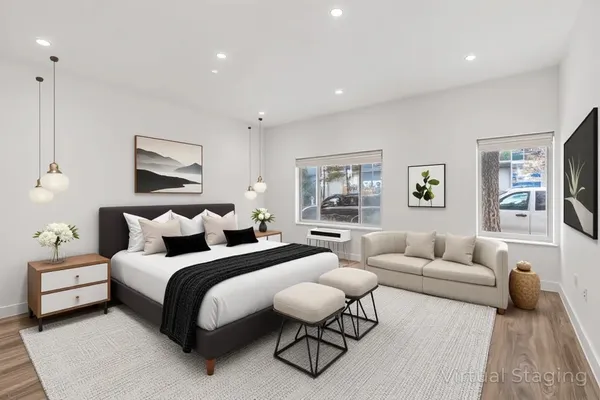 a bedroom with bed and a couch
