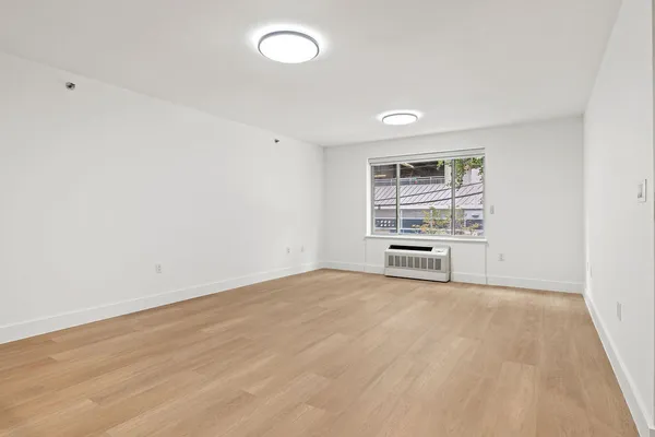 a view of an empty room with a window