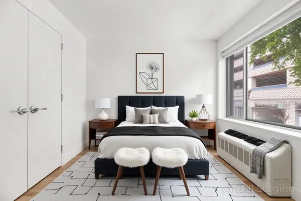 a bed room with a bed and a window