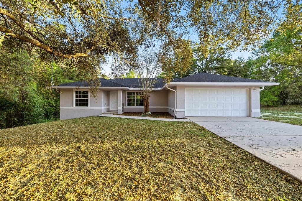 front view of a house with a yard