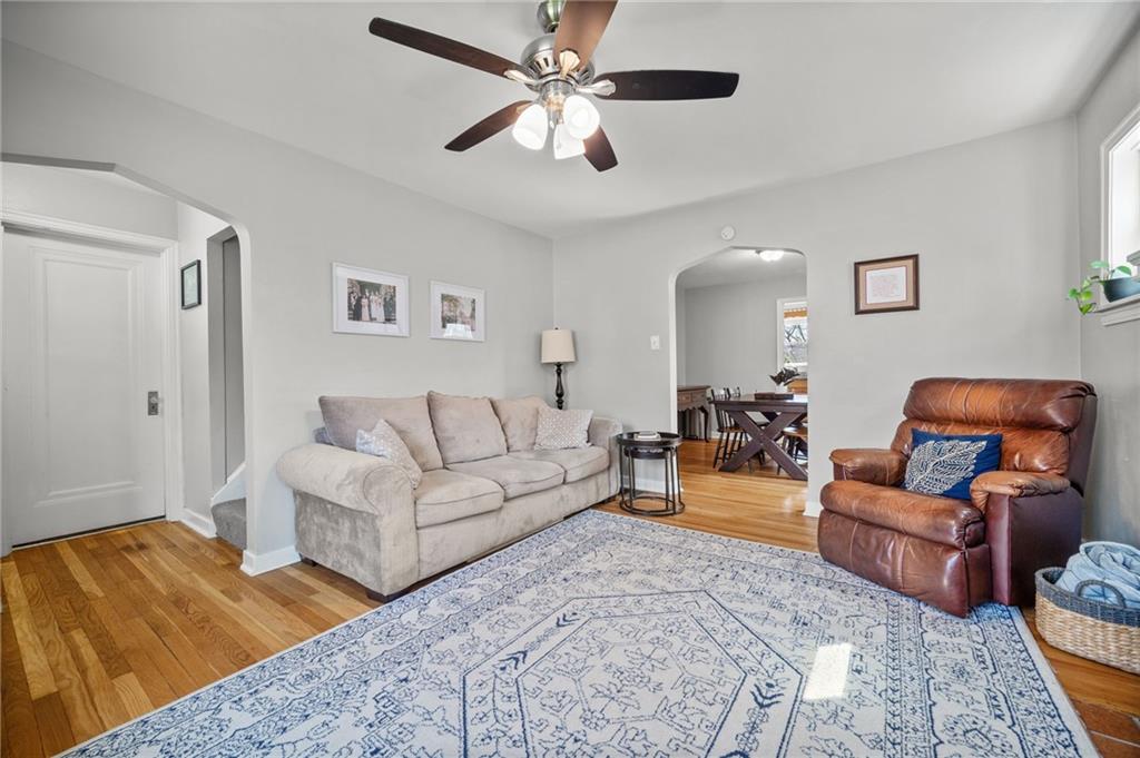 416 Phillips Avenue McKees Rocks, PA 15136 - Photo 9 of 46 a living room with furniture ceiling fan and a rug