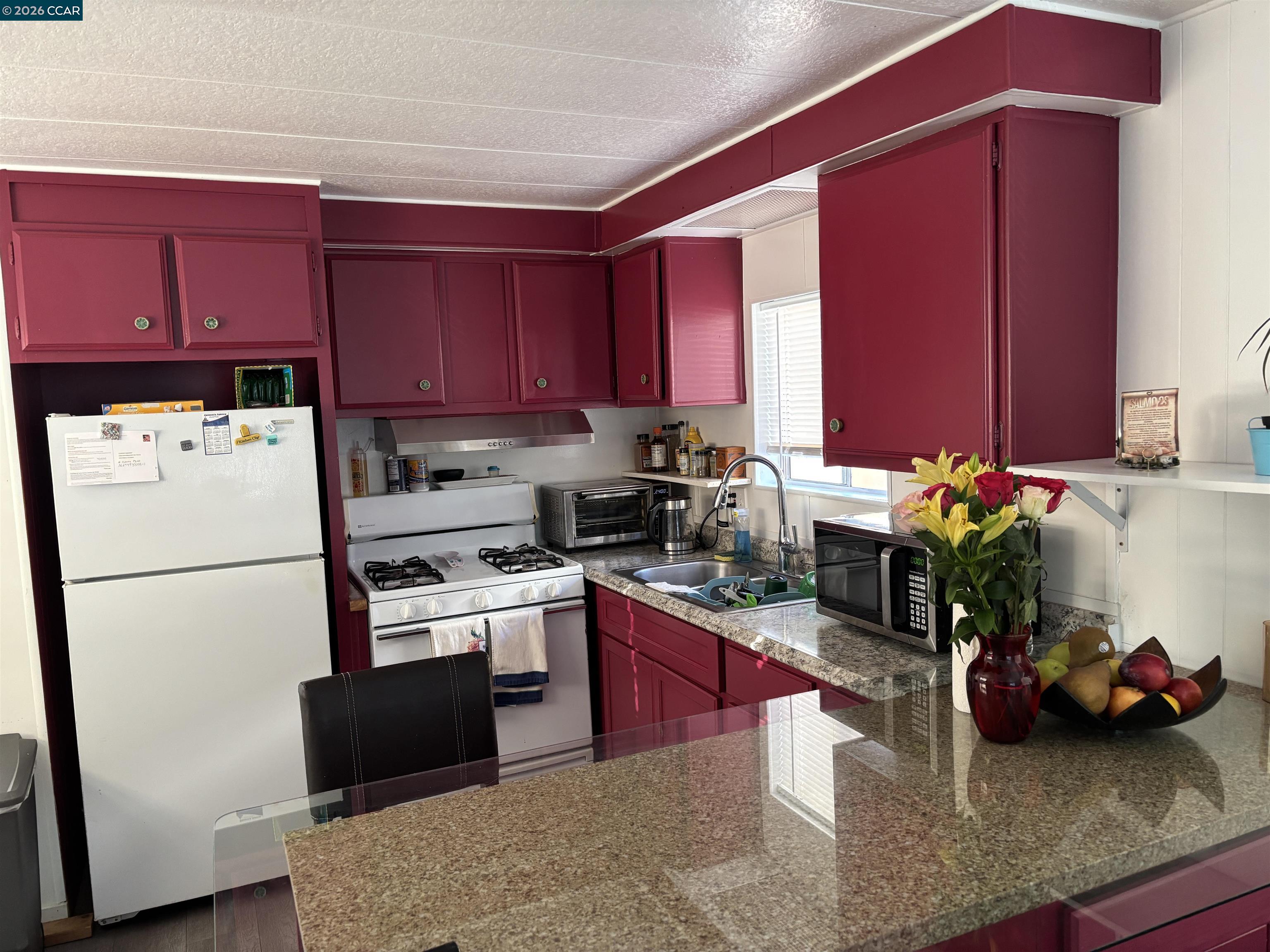 2990 San Pablo Dam Road, Unit 8 San Pablo, CA 94803 - Photo 4 of 13 a kitchen with refrigerator cabinets and wooden floor