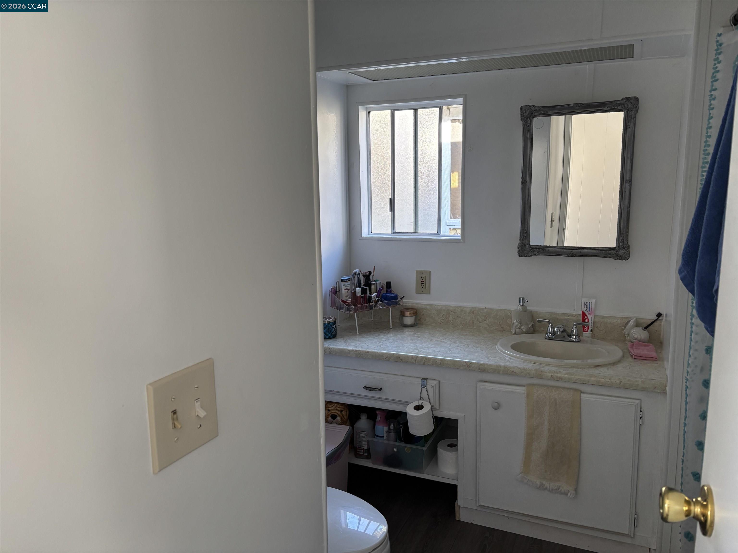 2990 San Pablo Dam Road, Unit 8 San Pablo, CA 94803 - Photo 8 of 13 a bathroom with a sink and a mirror