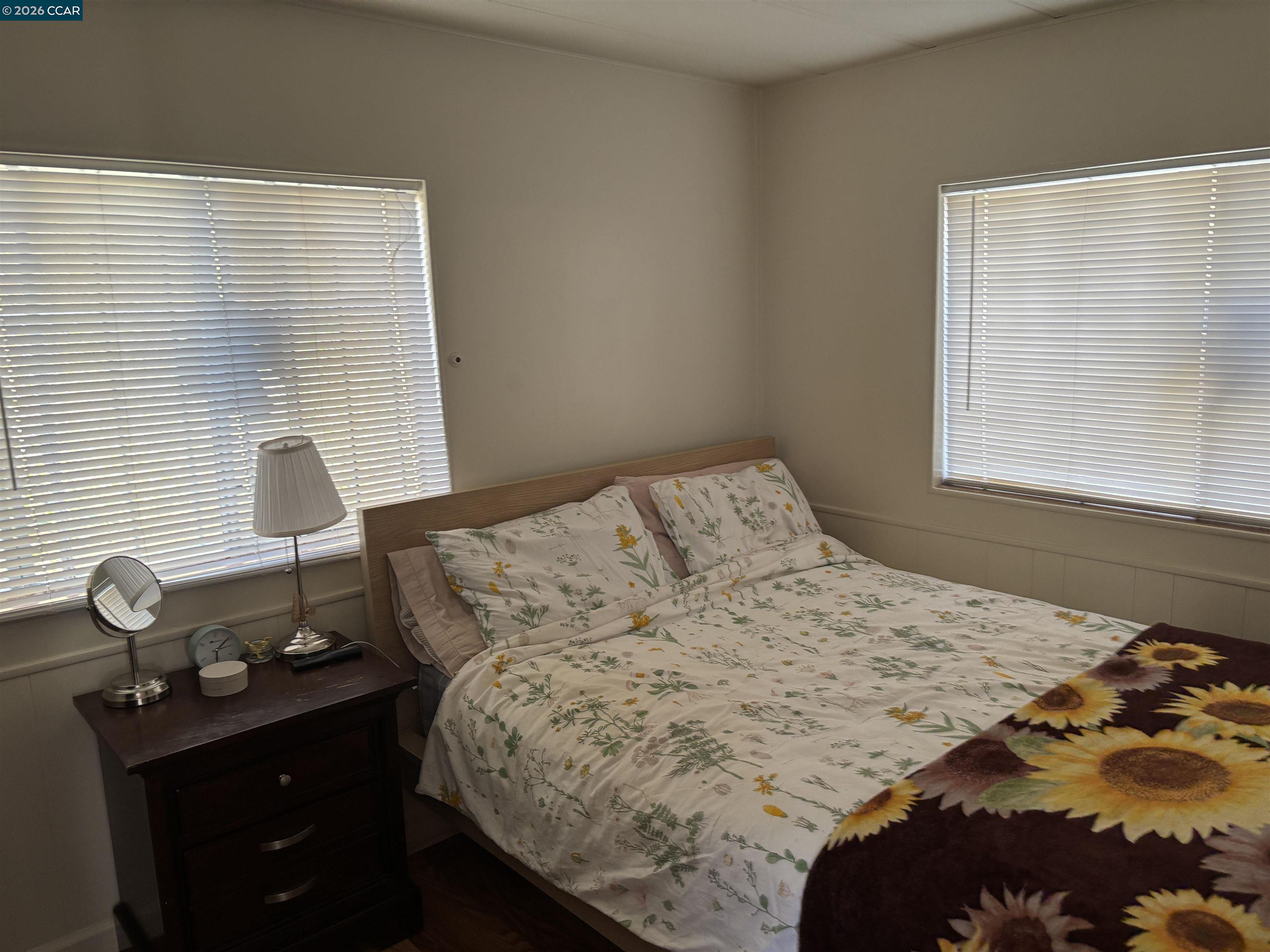 2990 San Pablo Dam Road, Unit 8 San Pablo, CA 94803 - Photo 10 of 13 a bedroom with a bed and a window