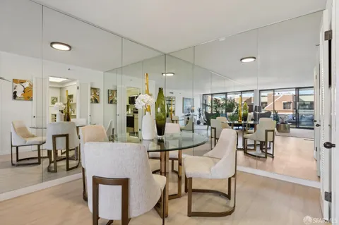 a view of entryway and hall with dining room