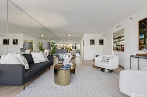 a bedroom with a large bed and a couch