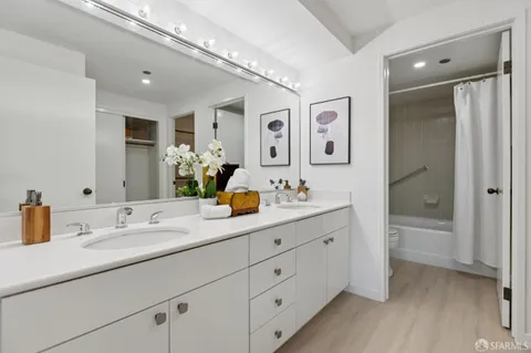 a bathroom with a shower curtain and a window