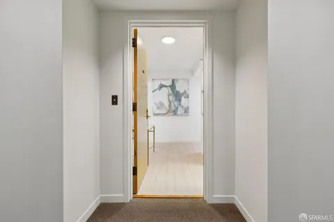 a kitchen with stainless steel appliances a stove microwave and sink