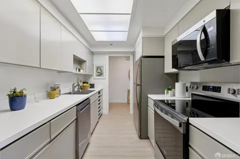 a living room with furniture large window and glass door