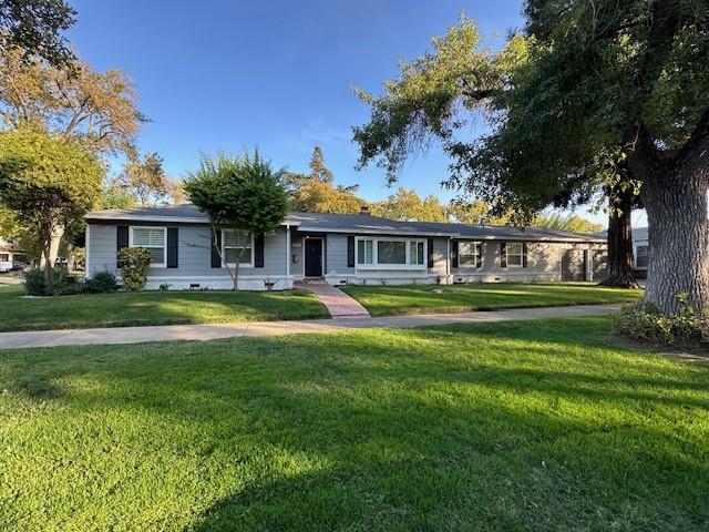 2550 4th Avenue Merced, CA 95340 - Photo 1 of 34 a view of house with a big yard and large trees