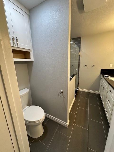 2550 4th Avenue Merced, CA 95340 - Photo 22 of 34 a bathroom with a toilet and a sink