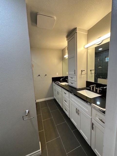 2550 4th Avenue Merced, CA 95340 - Photo 23 of 34 a bathroom with a double vanity sink and mirror