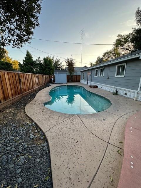 2550 4th Avenue Merced, CA 95340 - Photo 29 of 34 a view of a backyard with table and chairs couches fire pit and large trees