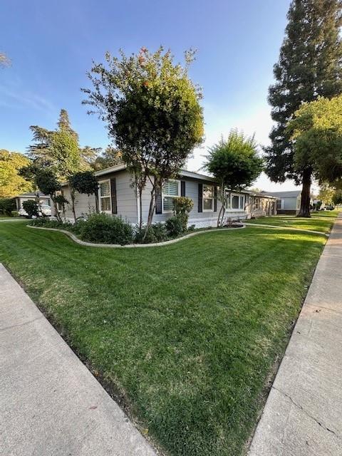 2550 4th Avenue Merced, CA 95340 - Photo 34 of 34 a front view of a house with a garden