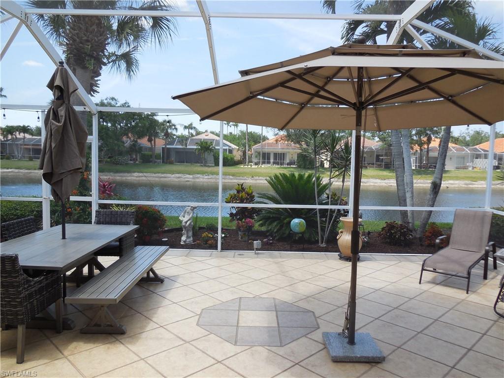 5441 Guadeloupe Way Naples, FL 34119 - Photo 2 of 45 Sunroom featuring a water view