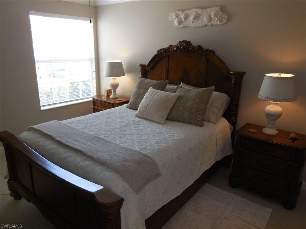 5441 Guadeloupe Way Naples, FL 34119 - Photo 23 of 45 Bedroom featuring tile patterned floors
