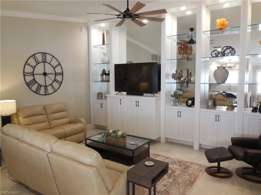 5441 Guadeloupe Way Naples, FL 34119 - Photo 5 of 45 Living room featuring ceiling fan, crown molding, light tile patterned flooring, and recessed lighting