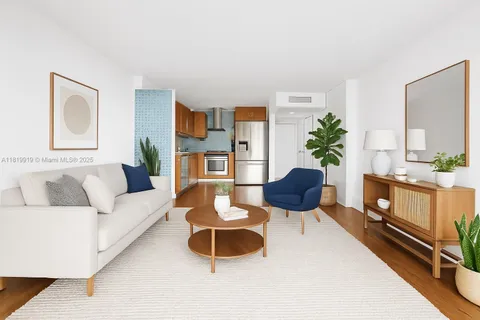 a living room with furniture a rug and a potted plant