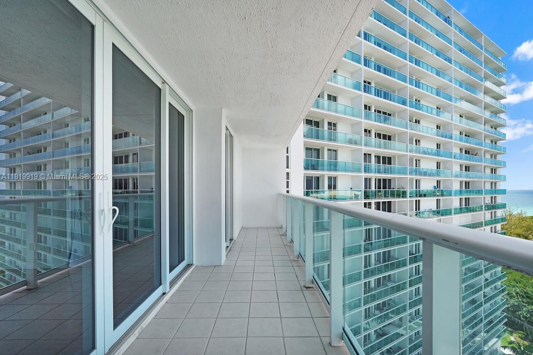 100 Bayview Drive, Unit 1223 Sunny Isles Beach, FL 33160 - Photo 15 of 34 a view of a balcony with a floor to ceiling window and stairs