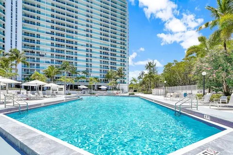 a view of swimming pool with outdoor seating