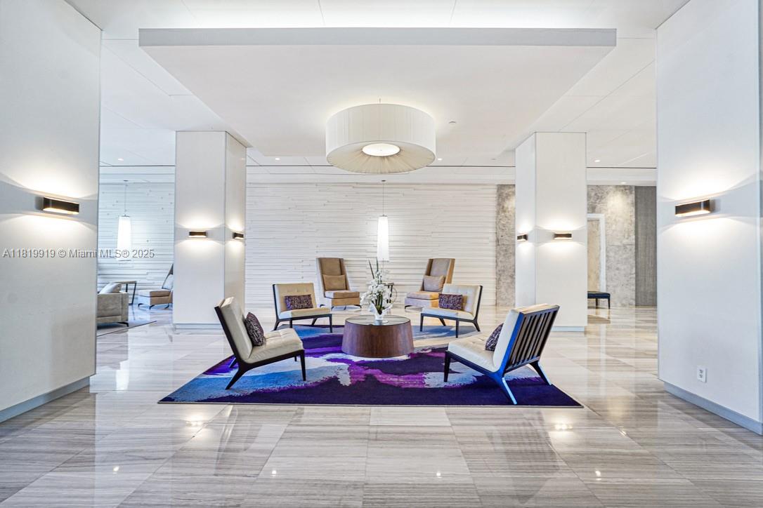 100 Bayview Drive, Unit 1223 Sunny Isles Beach, FL 33160 - Photo 30 of 34 a view of a dining room with furniture