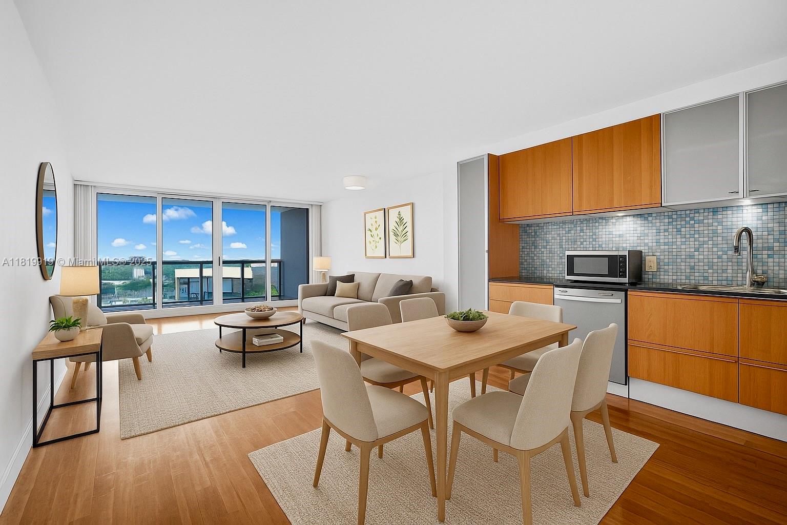 100 Bayview Drive, Unit 1223 Sunny Isles Beach, FL 33160 - Photo 5 of 34 a dining room with a table chairs and a kitchen view