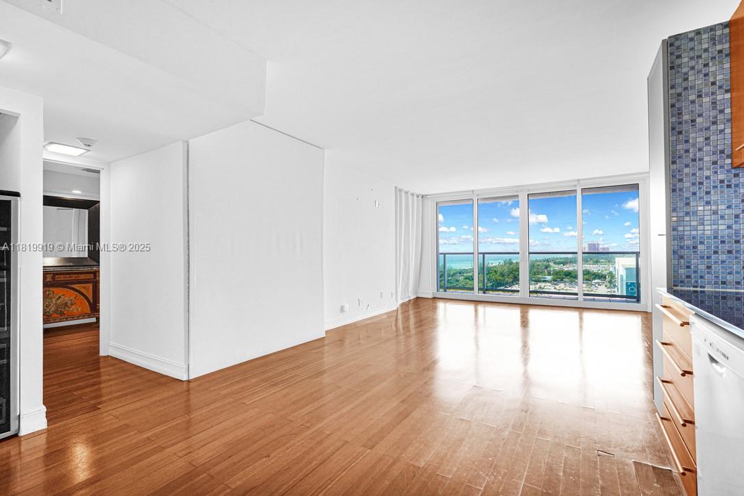 100 Bayview Drive, Unit 1223 Sunny Isles Beach, FL 33160 - Photo 8 of 34 a view of empty room with wooden floor and fan