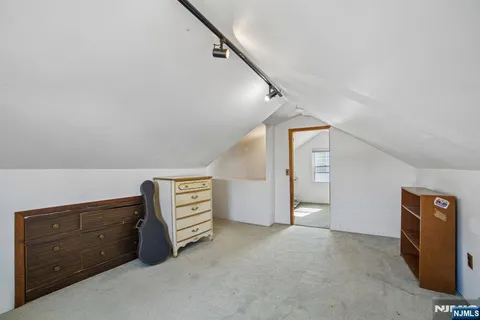 a view of room with cabinet and stairs